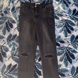 Black skinny jeans with knee rips